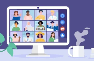 Illustration of a virtual video meeting displayed on a desktop computer screen. The screen shows a grid of diverse people participating in an online call, with video call icons along the side. A steaming coffee mug and a plant sit beside the computer on a desk against a purple background.