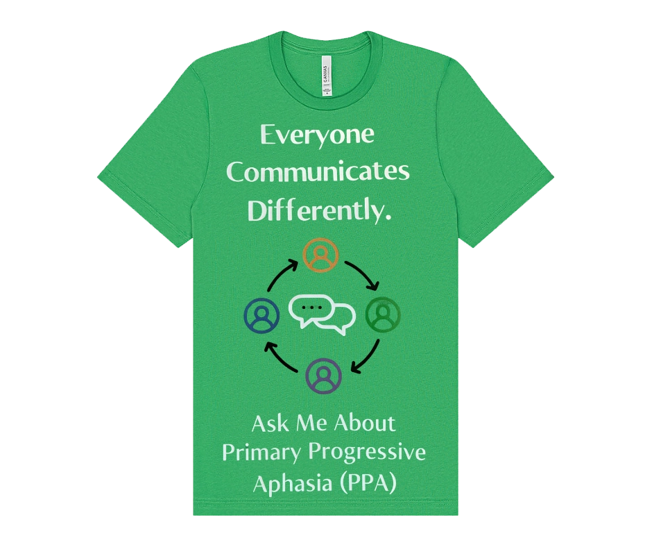 Front of a bright green T-shirt with the message “Everyone Communicates Differently.” Below the text is a graphic of four people icons connected in a circle around speech bubbles. The shirt also says, “Ask Me About Primary Progressive Aphasia (PPA).”