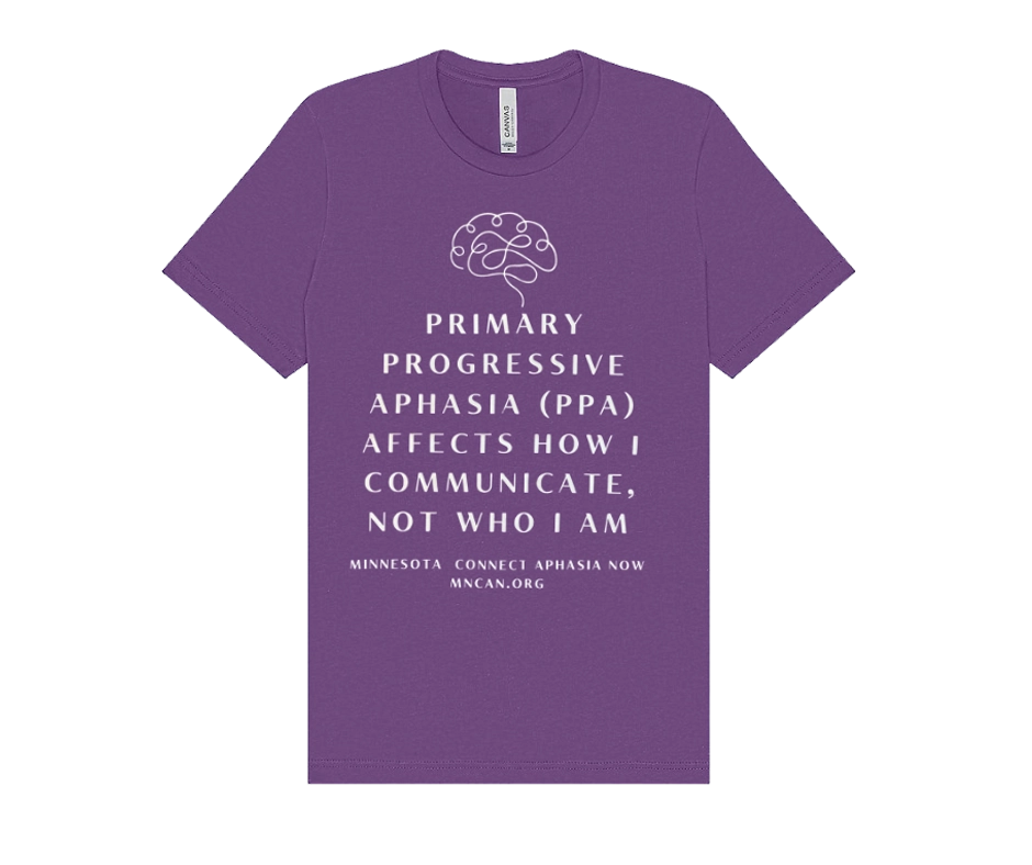Purple T-shirt featuring a white line-art brain graphic above the text: “Primary Progressive Aphasia (PPA) affects how I communicate, not who I am.” The shirt also includes the organization name “Minnesota Connect Aphasia Now” and the website “MNCAN.org.”